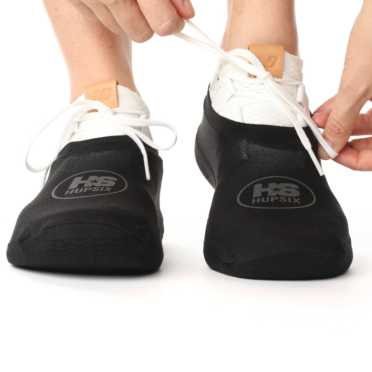 The HupSix over sneaker socks. They protect your knees and ankles twisting and turning on carpeted floors. They are one size fits all for men and women and are required for all HupSix classes.